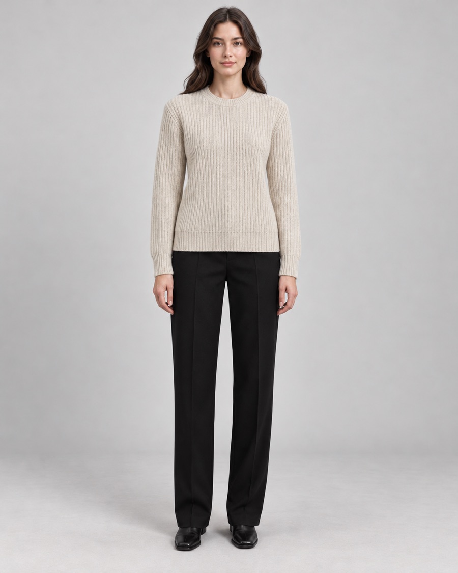 The same saved model wearing an oatmeal knit sweater